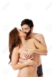 man fondles female partner's breasts